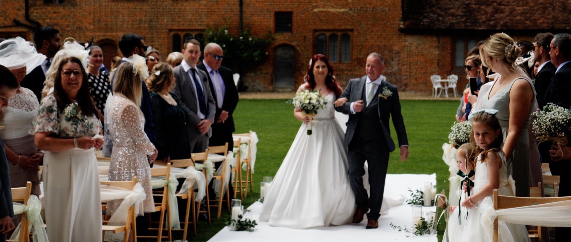 Walking down the aisle bride at Leez Priory wedding video.jpg
