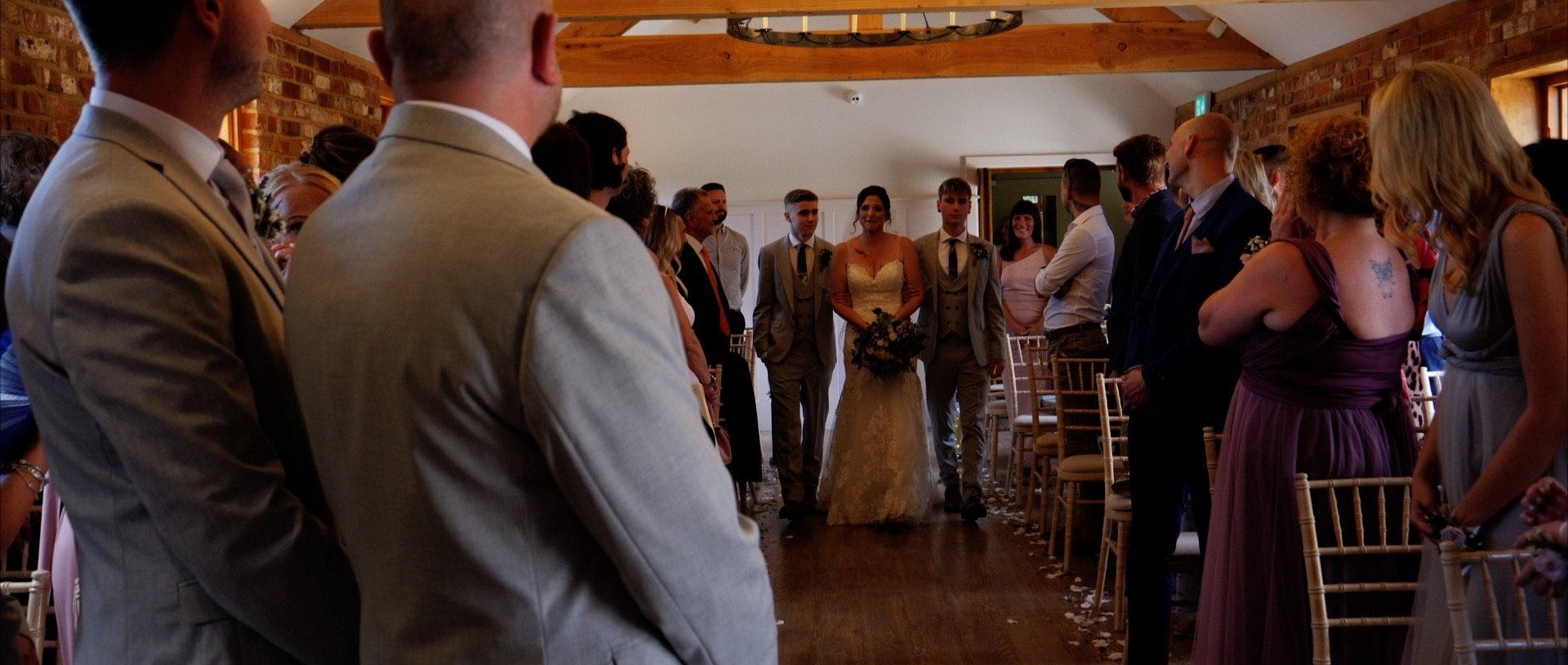 Bride walking down the aisle at Apton Hall Essex.jpg