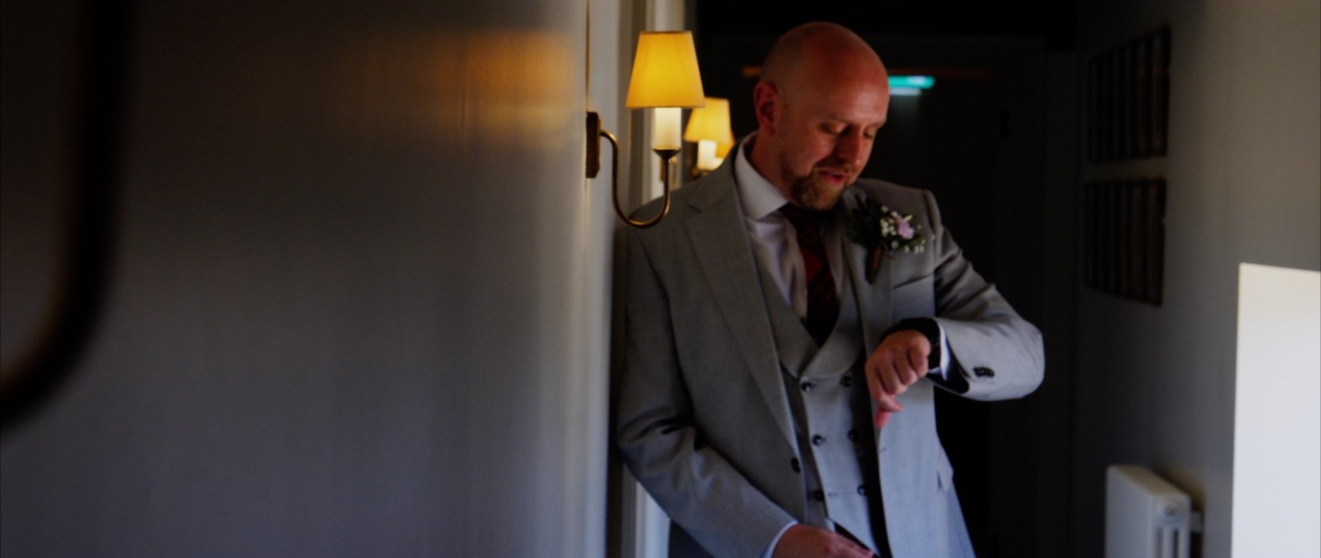 Everyting is on time at the wedding groom checking watch.jpg
