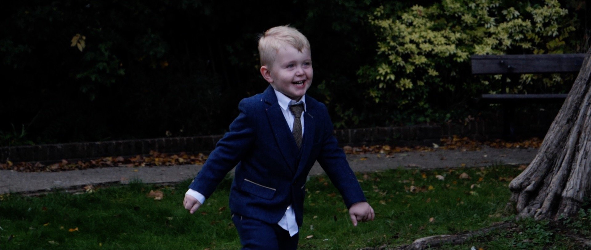 Little boy running at wedding in Essex.jpg
