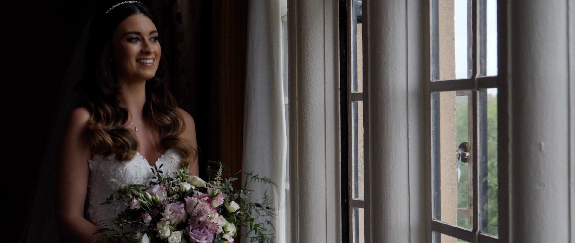 Beautiful bride at window Essex videos.jpg