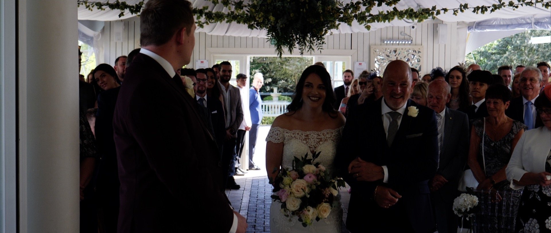 Walking down the aisle at Friern Manor Essex wedding Videos.jpg