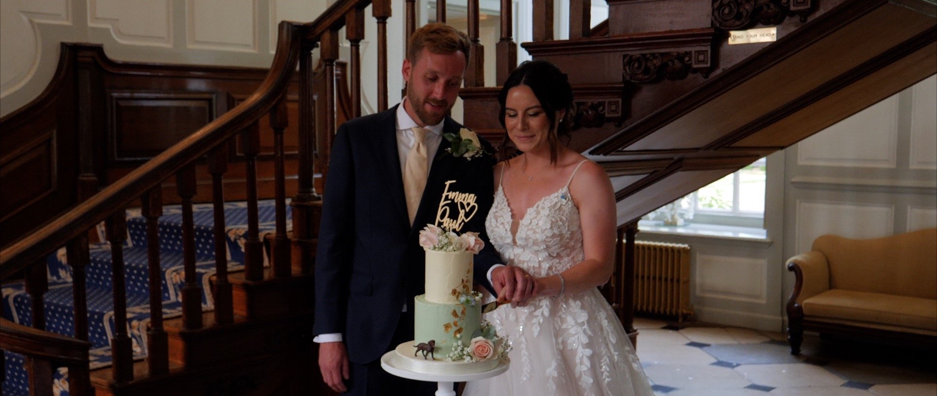 Cutting the wedding cake at Gosfield Hall - wedding videography.jpg