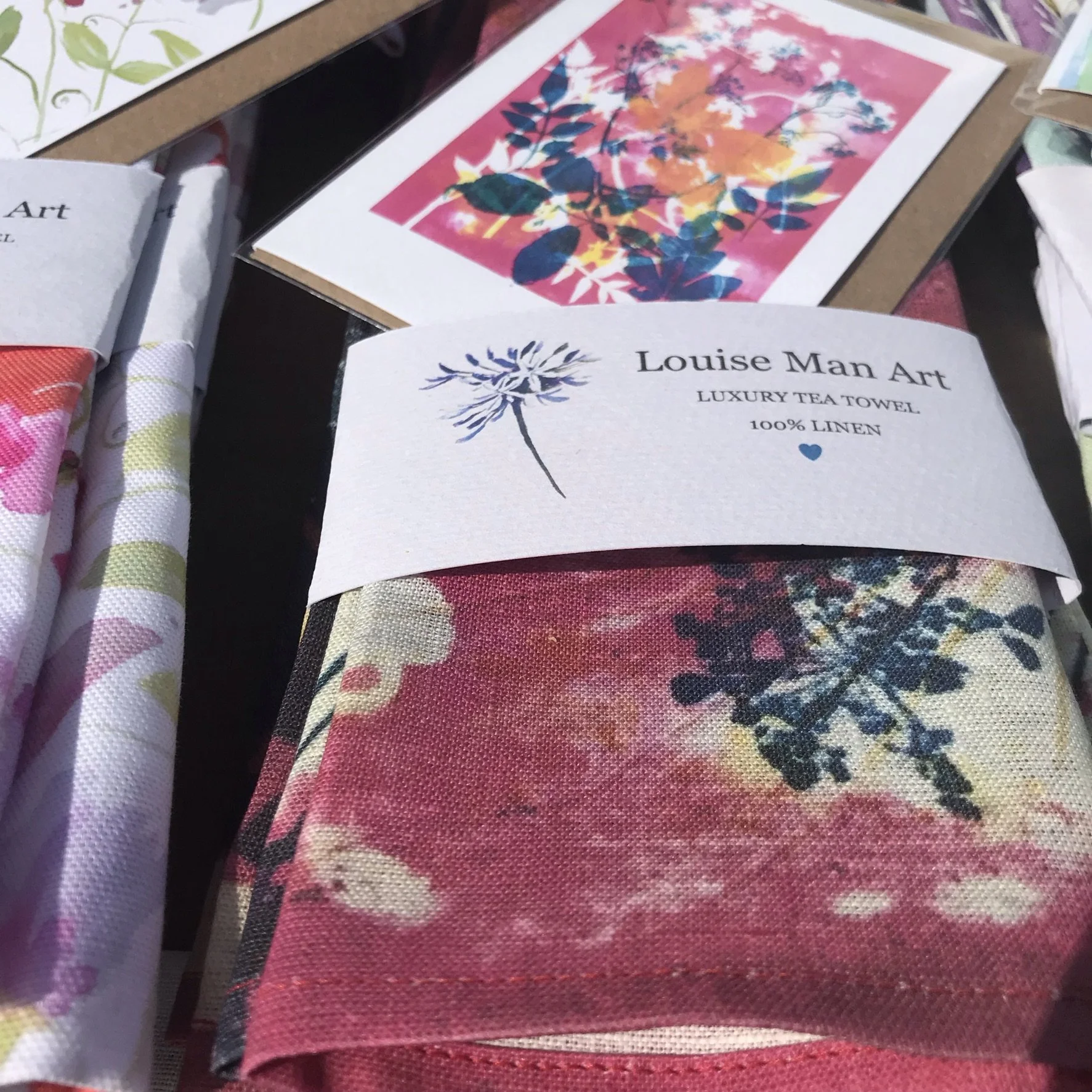 Botanical blue and white cow parsley on pink luxury tea towel