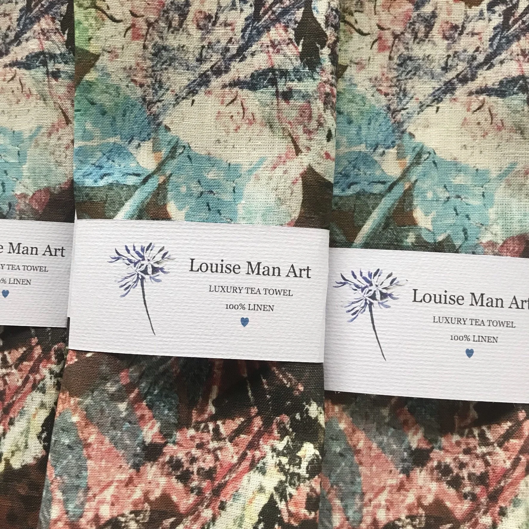 Tea towel with autumn colours of pinks and browns