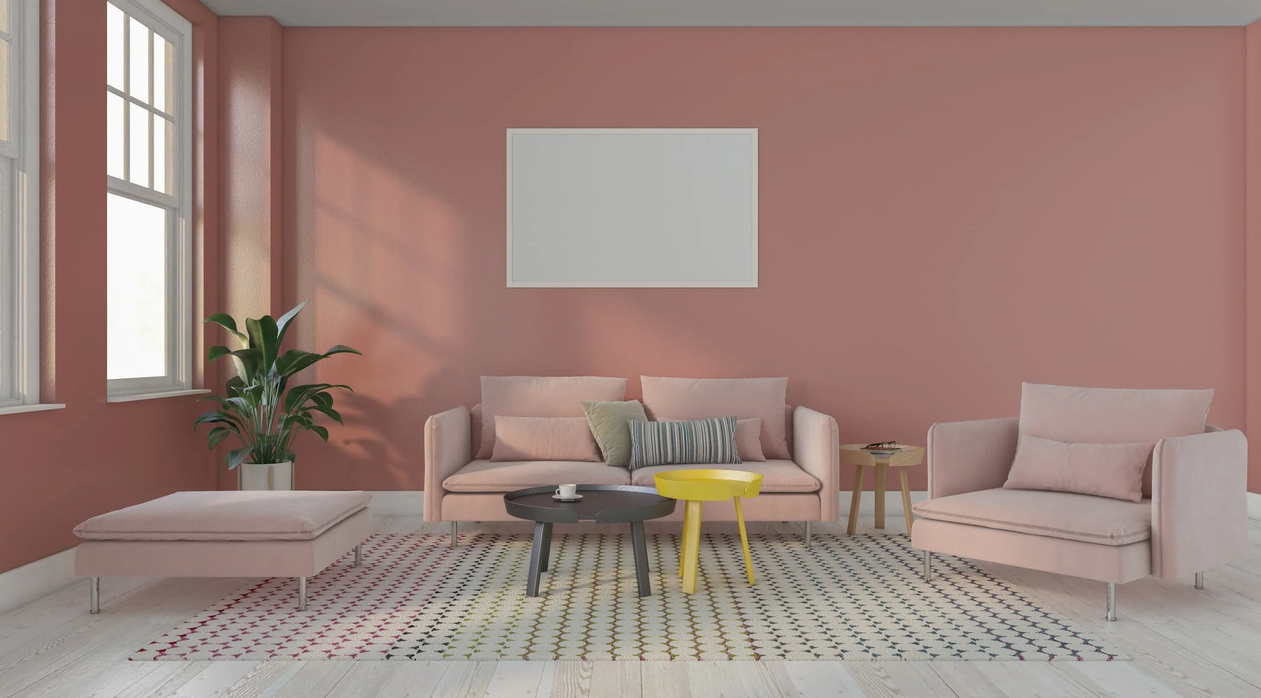 A spacious living room with dusky pink walls, armchair, sofa and footrest.
