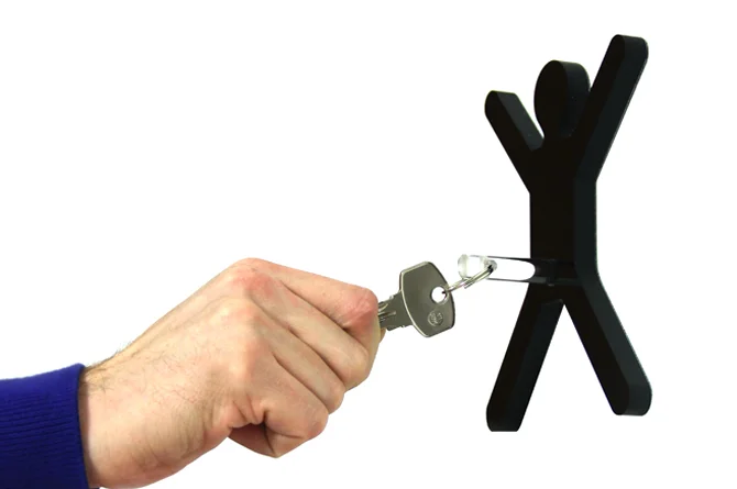 Close-up of the removable cylinder component holding a set of keys, highlighting the modular functionality.