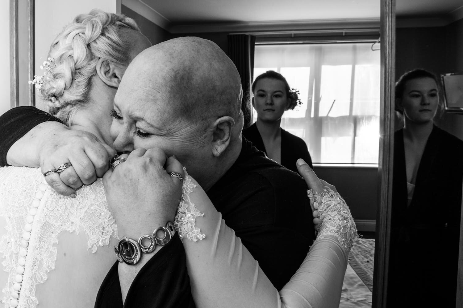 Bride hugs her mother