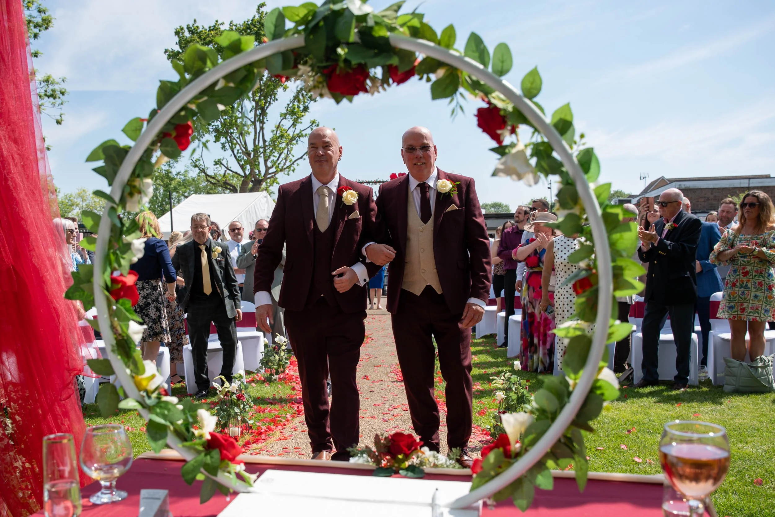 Tony & Andy the ceremony - walking up the aisle laughing