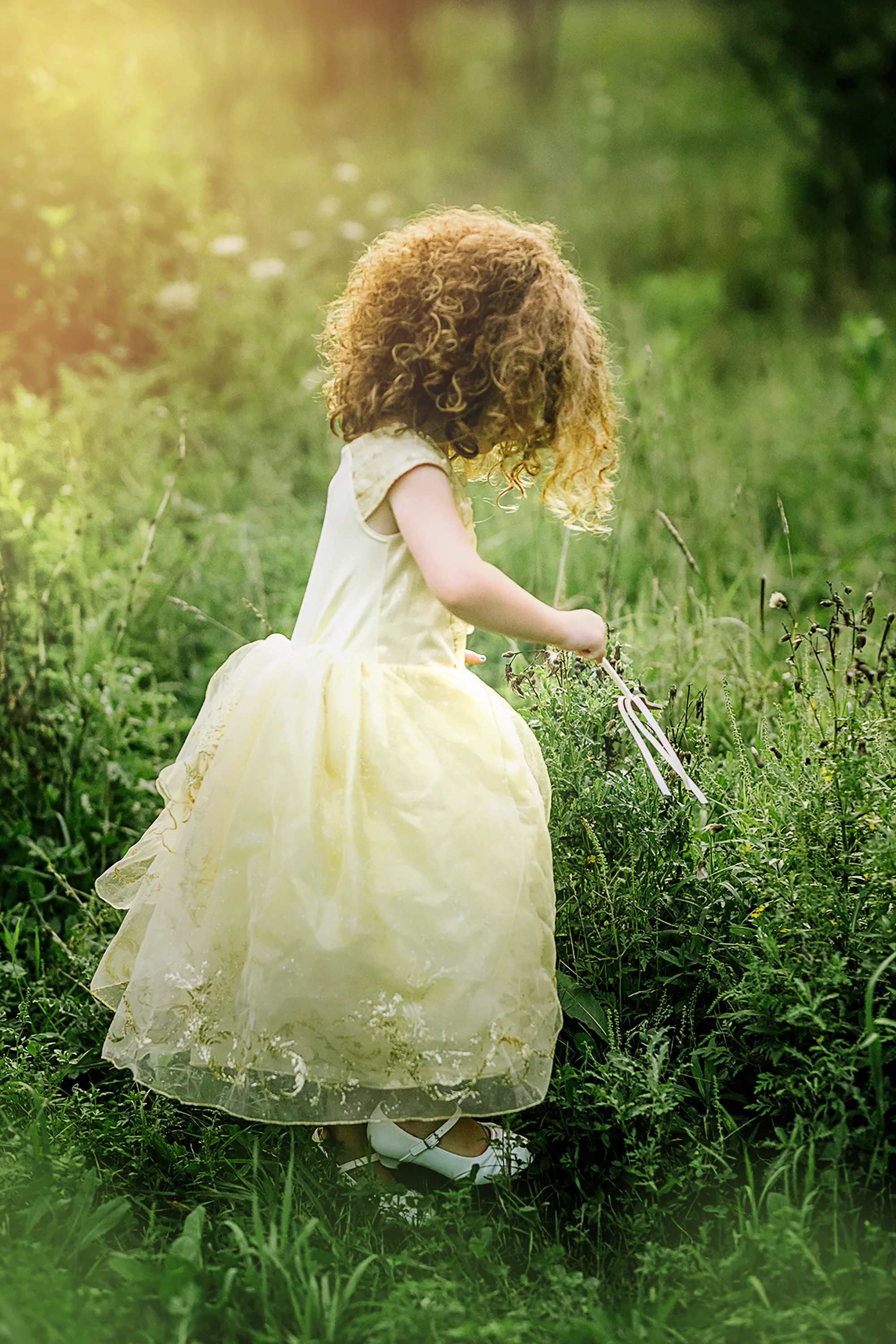 Caucasian redhaired girl dancing in field.jpg