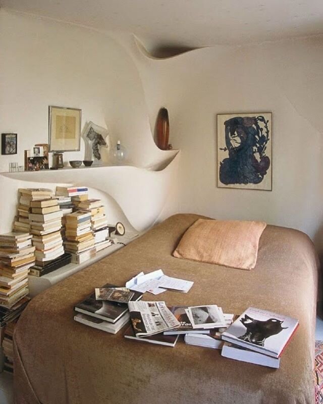 Artist Valentine Schlegal and Yvonne Brunhammer's bedroom in Montparnasse in Paris where they lived from the 1960s, with shelves and ledges Valentine sculpted for books and ceramics she made. Photographed by Eric Marin for @theworldofinteriors 2012. 