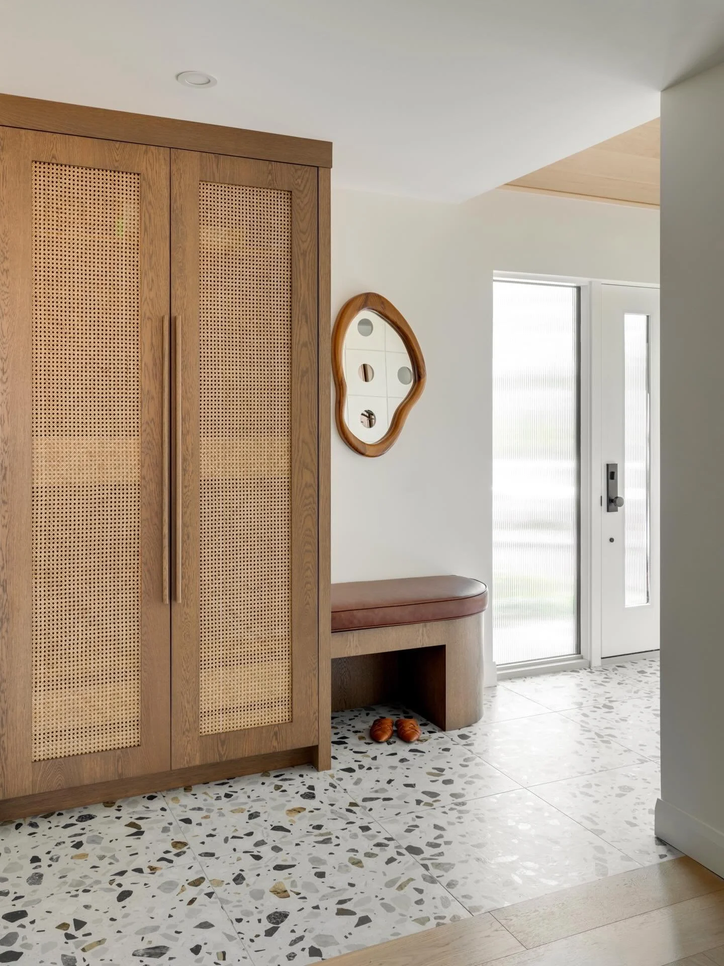 An entry closet doesn&rsquo;t just have to be a boring box &mdash; at our #SFCoachHillReno, we incorporated a rounded bench, oak pulls, and some gorgeous caning panels to add that extra &ldquo;wow&rdquo;!

📸: @kmphotographyinteriors