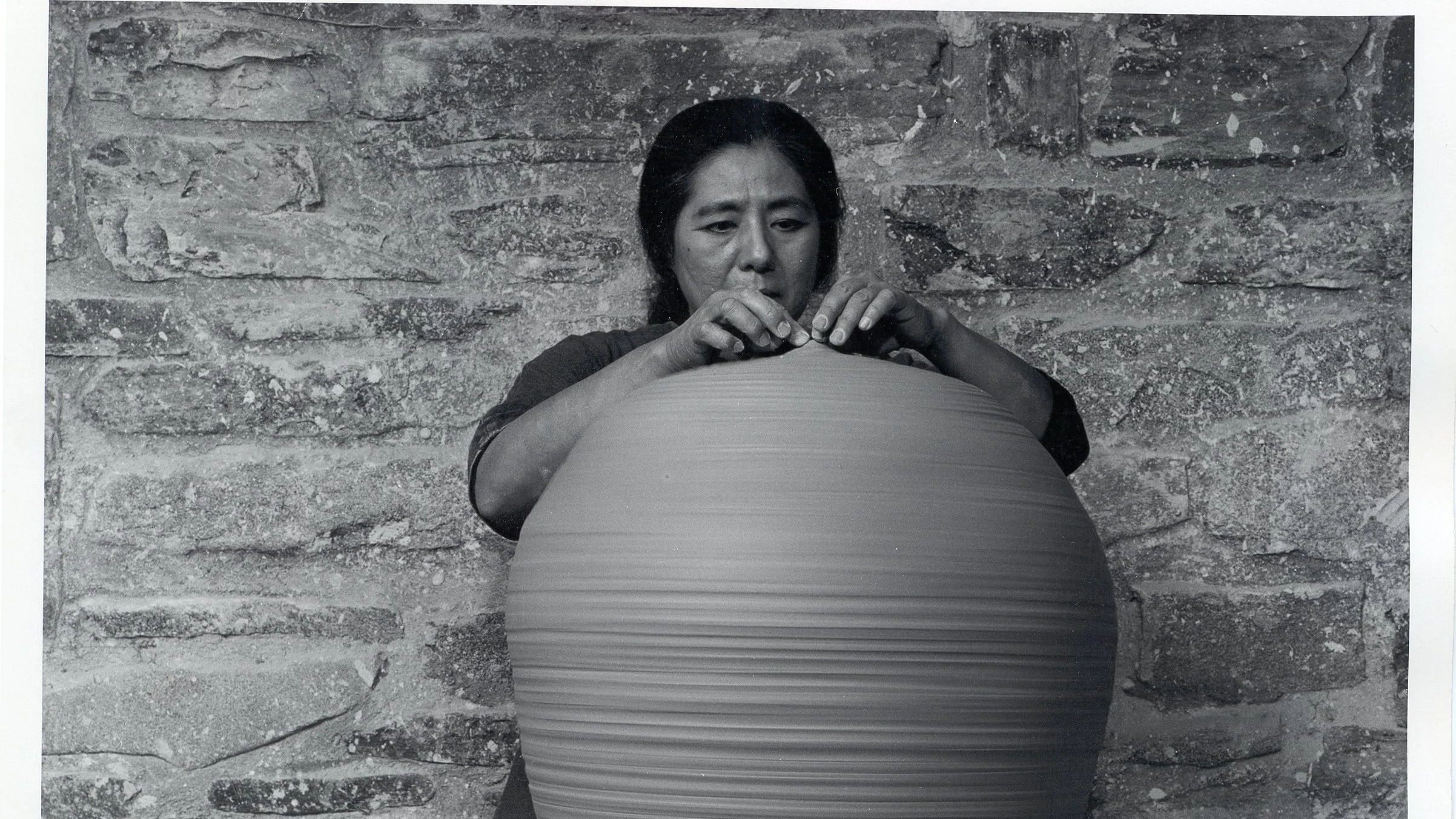  Takaezu working on the wheel, finishing a closed form. Photo credit: Evon Streetman 