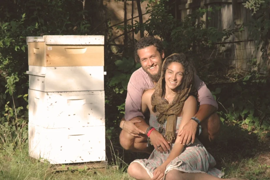 Justin Maness and his wife Juliana with their first hive