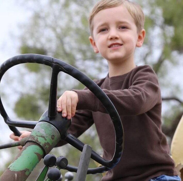 son on tractor copy.jpg