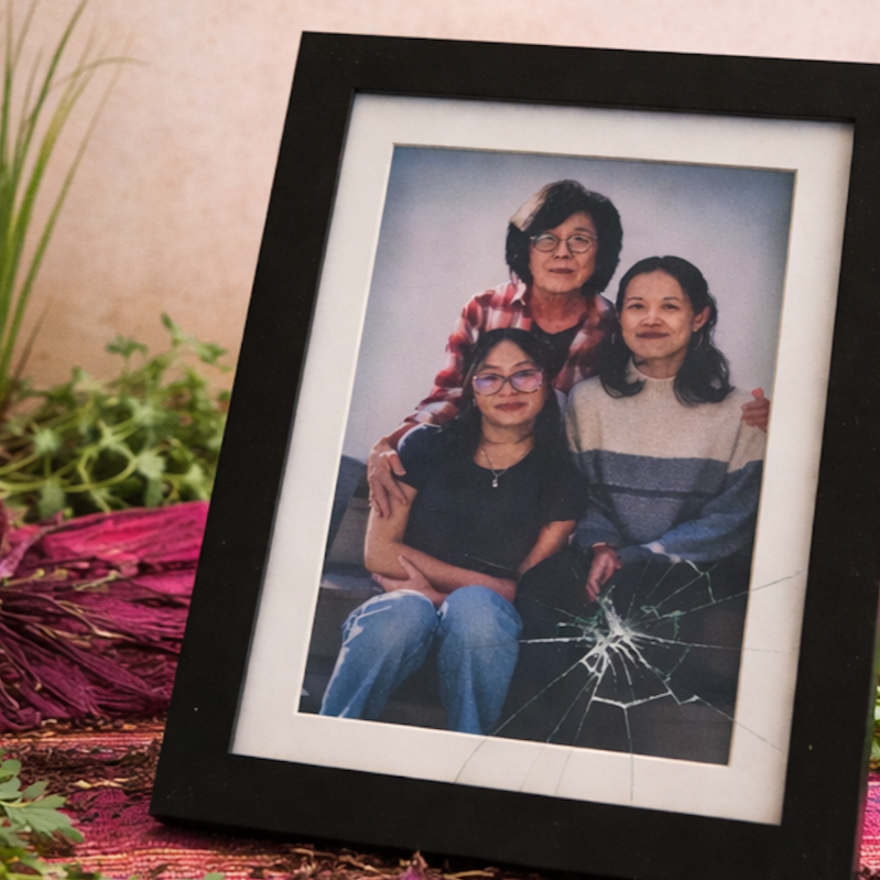 A cracked family portrait of Maly, Fhoua, and Zong