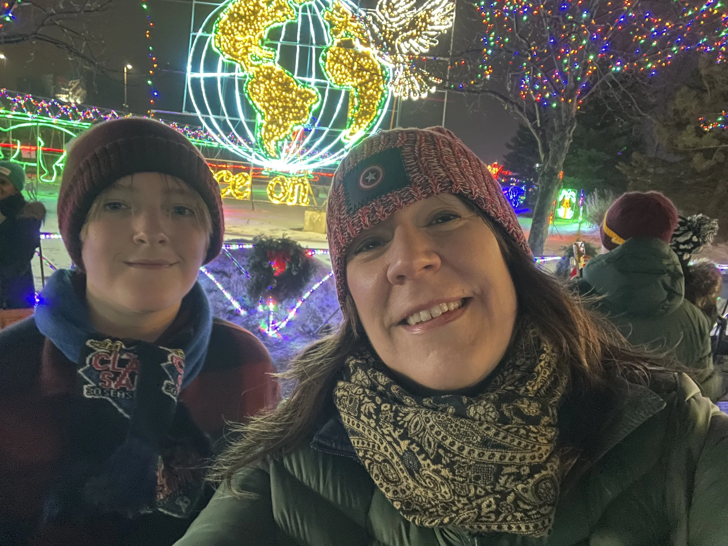 Emily D. H. Olson and her son at a winter lights event.