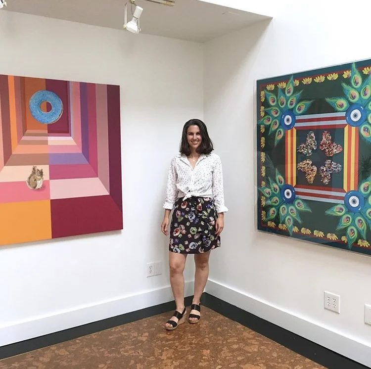 Mione with a few of her gorgeous paintings. Photo c/o Mione Plant with Maestri Gallery