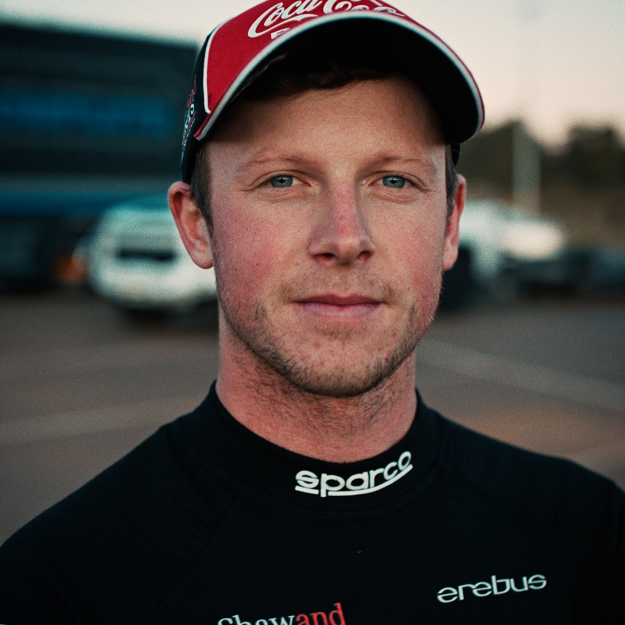 Will Brown race car driver staring down the lens as a hero shot. 