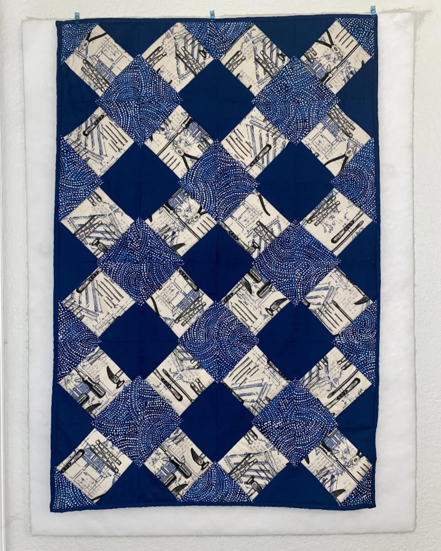 not making a lot of quilts these days but had to cut into some carpentry fabric for a new treehouse crew baby 💙