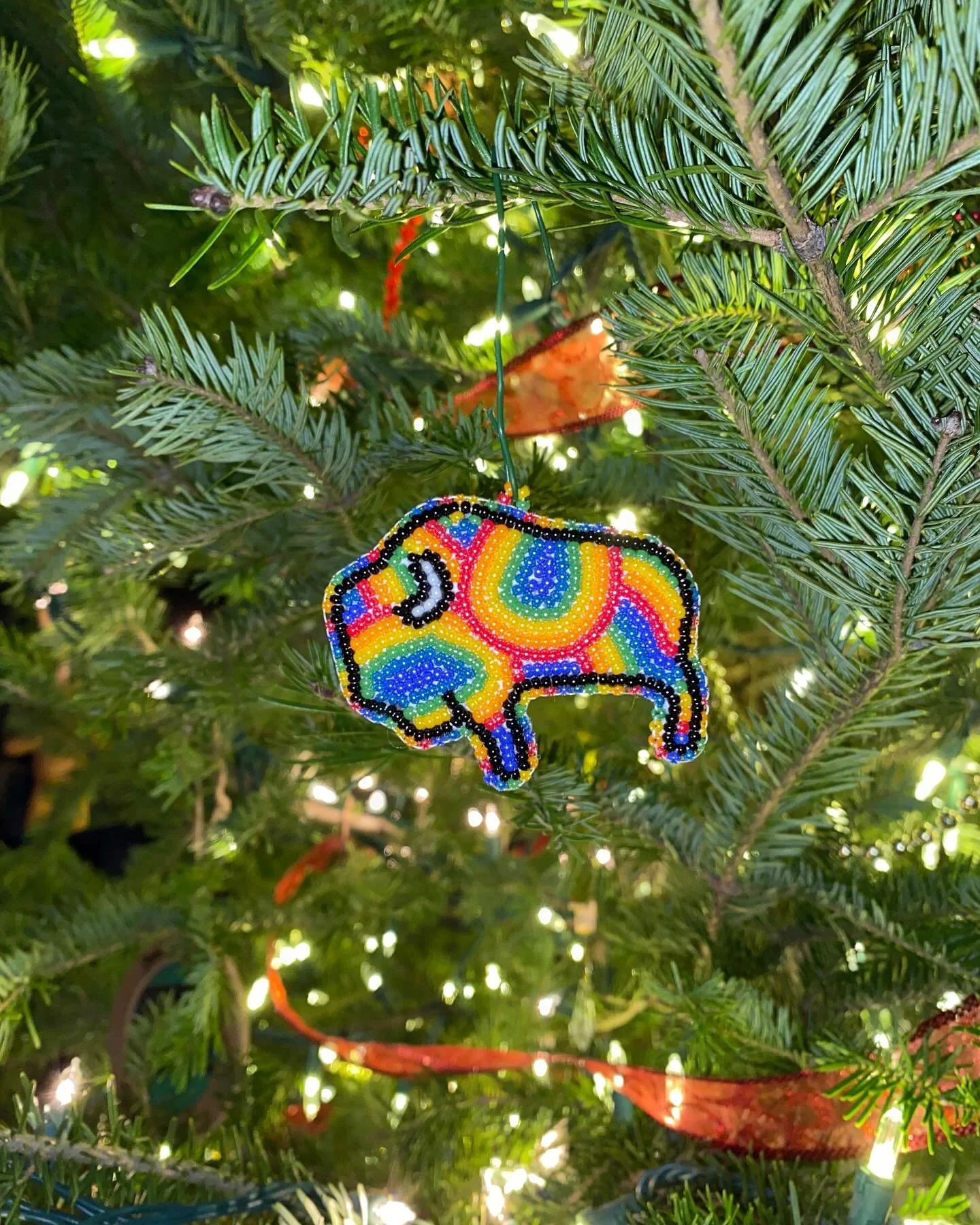 little tie dye rainbow buffalo ornament up for grabs (could also be threaded onto a necklace or hung wherever makes you happy) ~•~ katehartstudio on e t s y ~•~