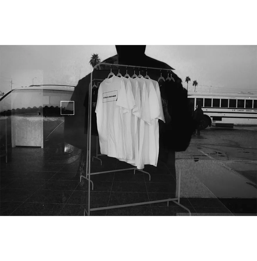 self-portrait-w-shirt-rack.jpg