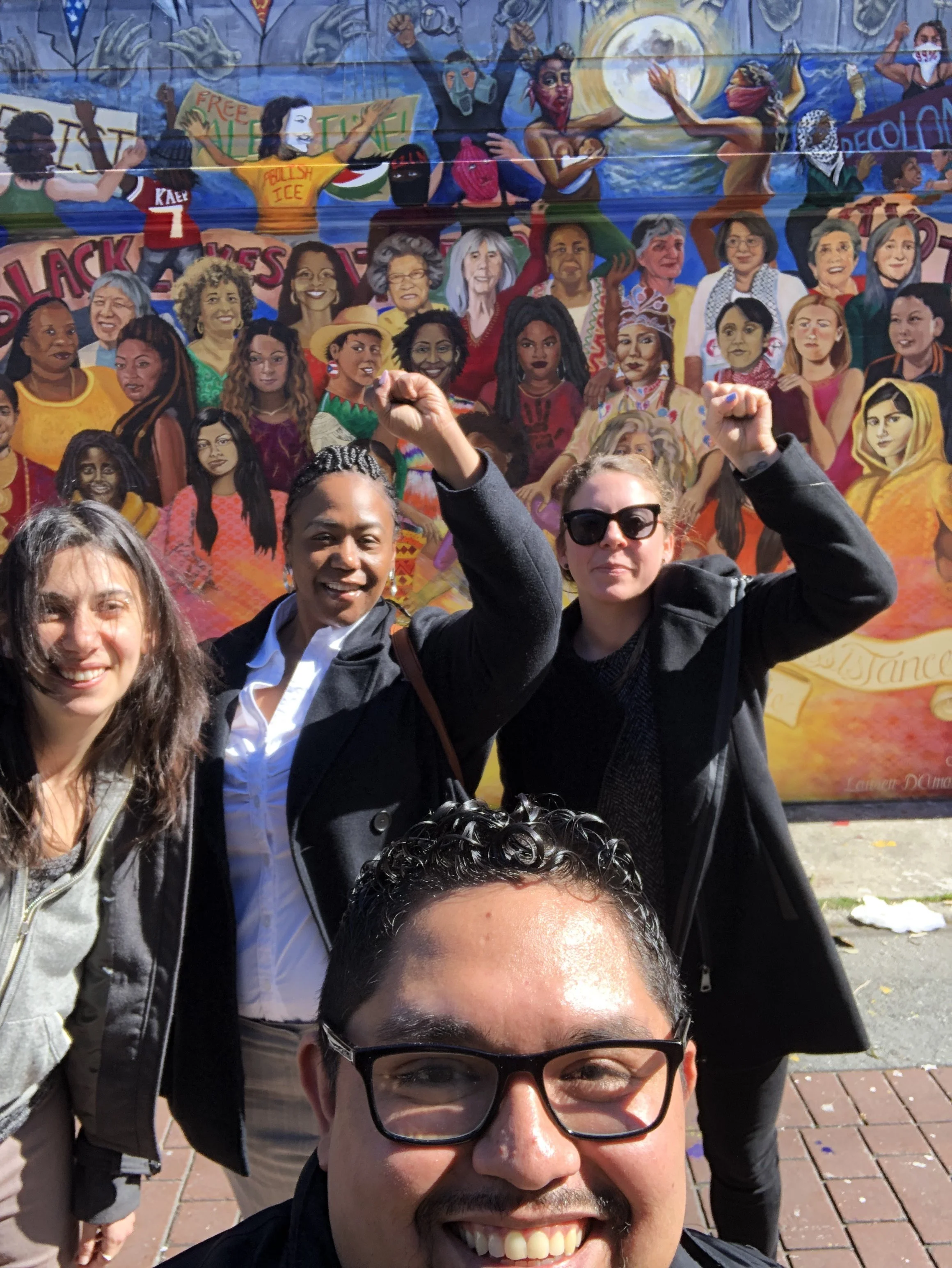 The fabulous team from CSJ out in front of the Women of the Resistance Mural on Balmy Ally.