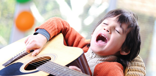 Boy singing with guitar