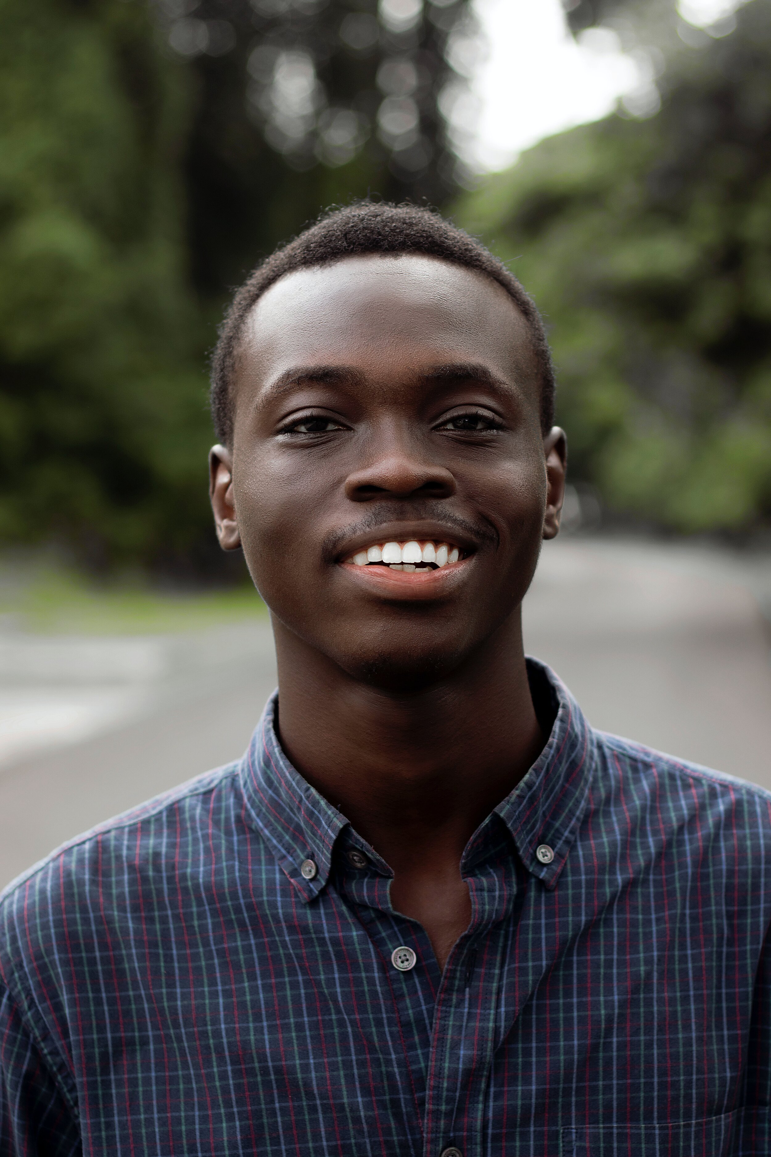 timothy-ayegbede-man smile-unsplash.jpg