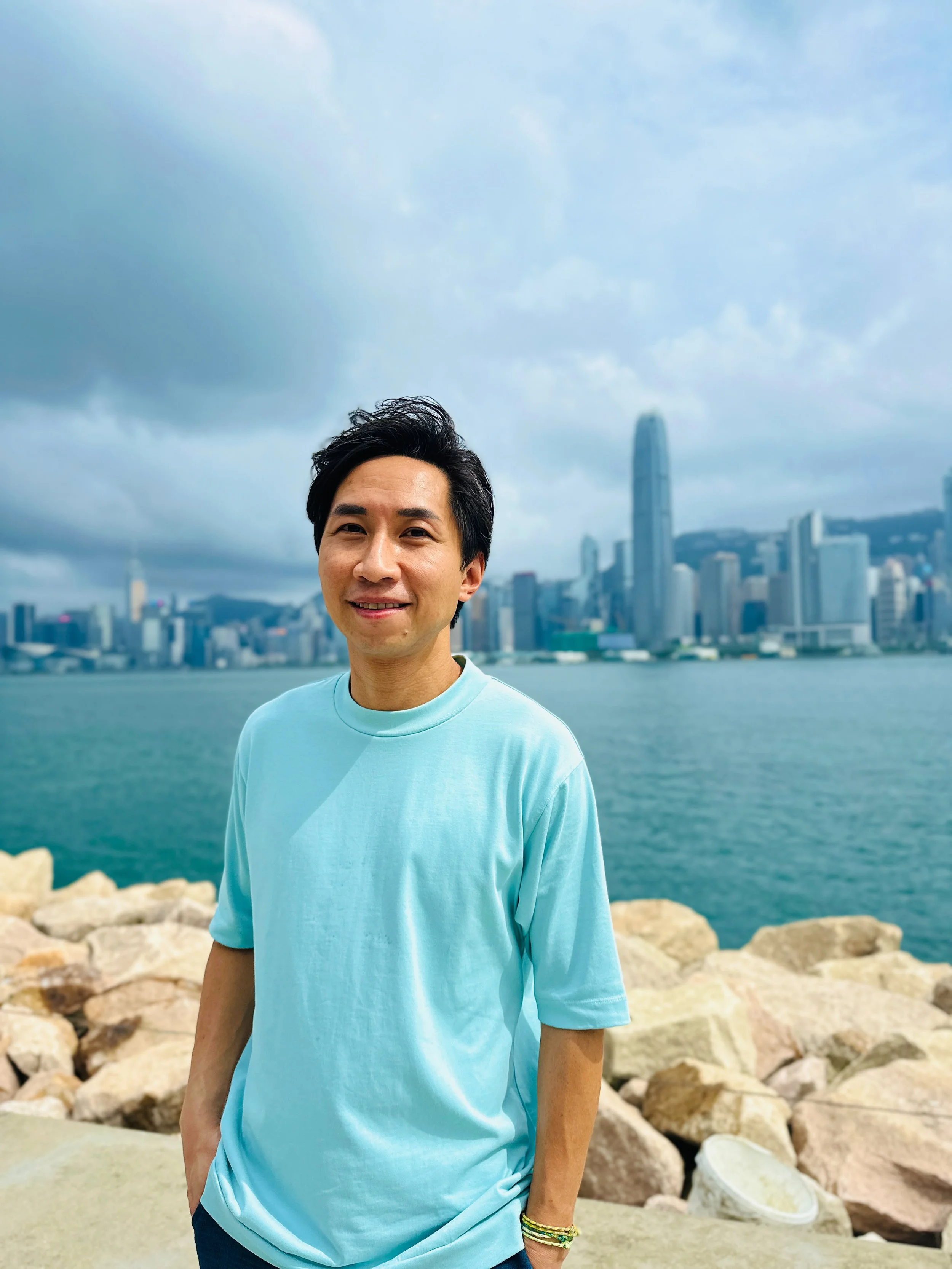 Raymond, Hello! Hong Kong Tours guide, standing in a Hong Kong neighborhood