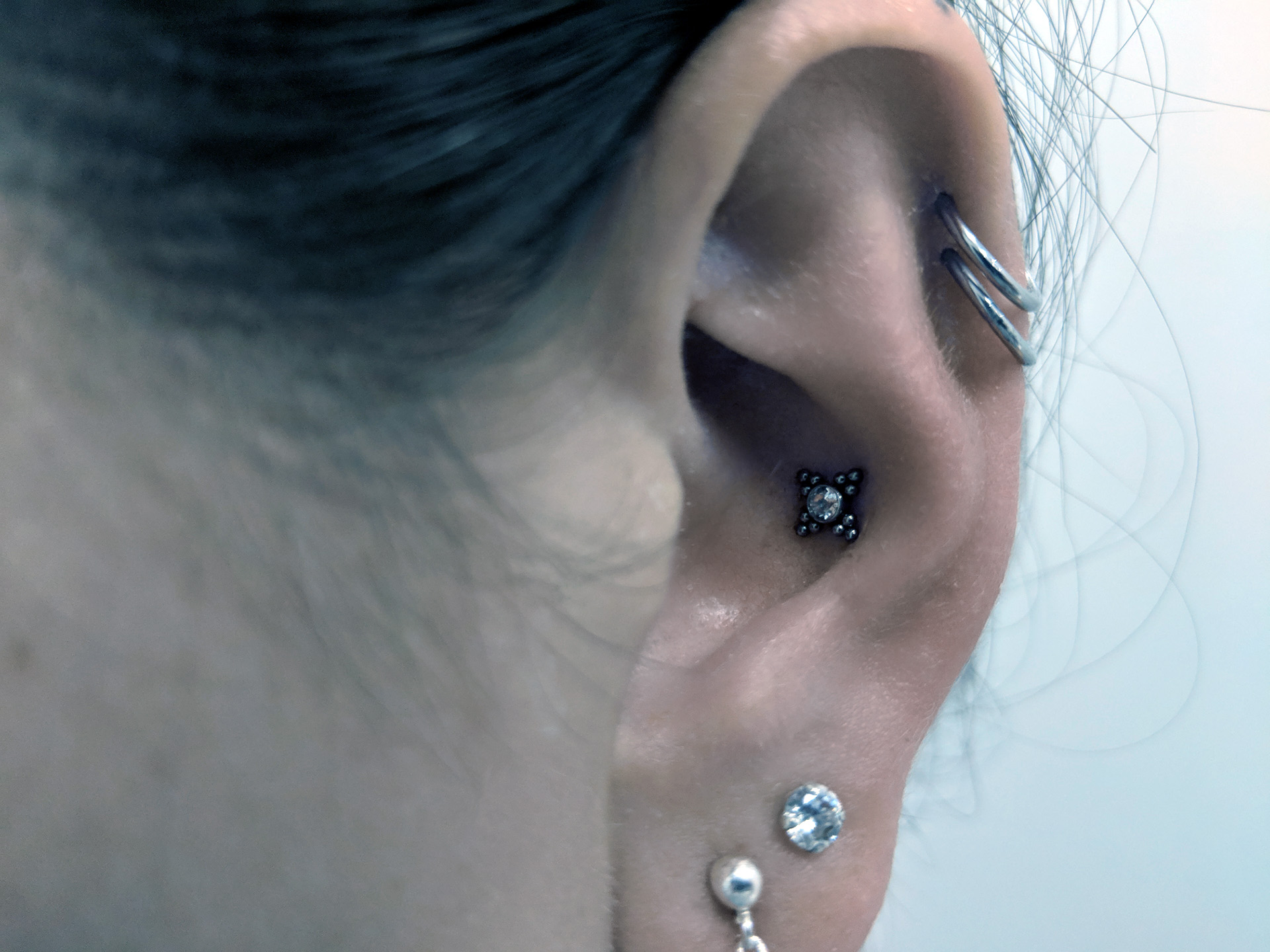 Double Helix Piercing with Conch Piercing