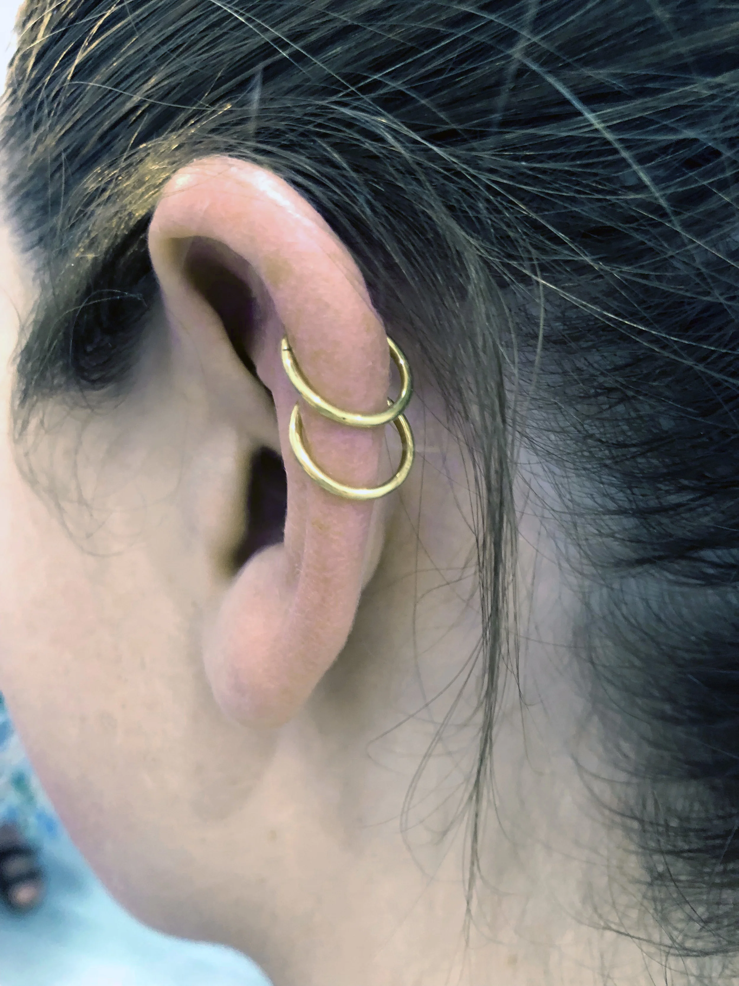 Classic Helix piercing with double gold rings