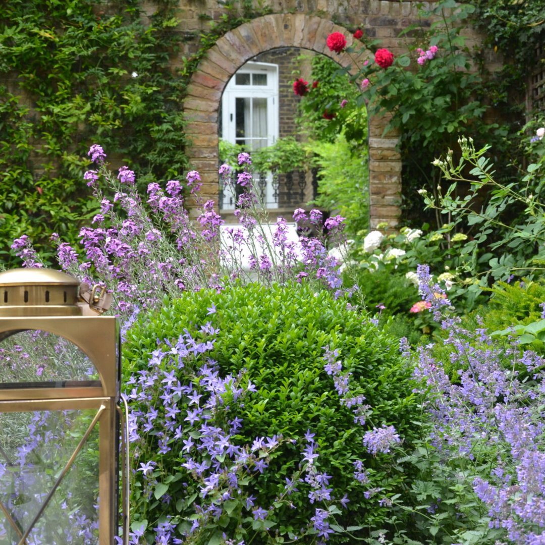 When we first visited this London garden, it felt dark and it was dominated by this urn in the centre - reducing the useable space. 
 
These images show the journey from before, through the design we created, and how that translated into the finished