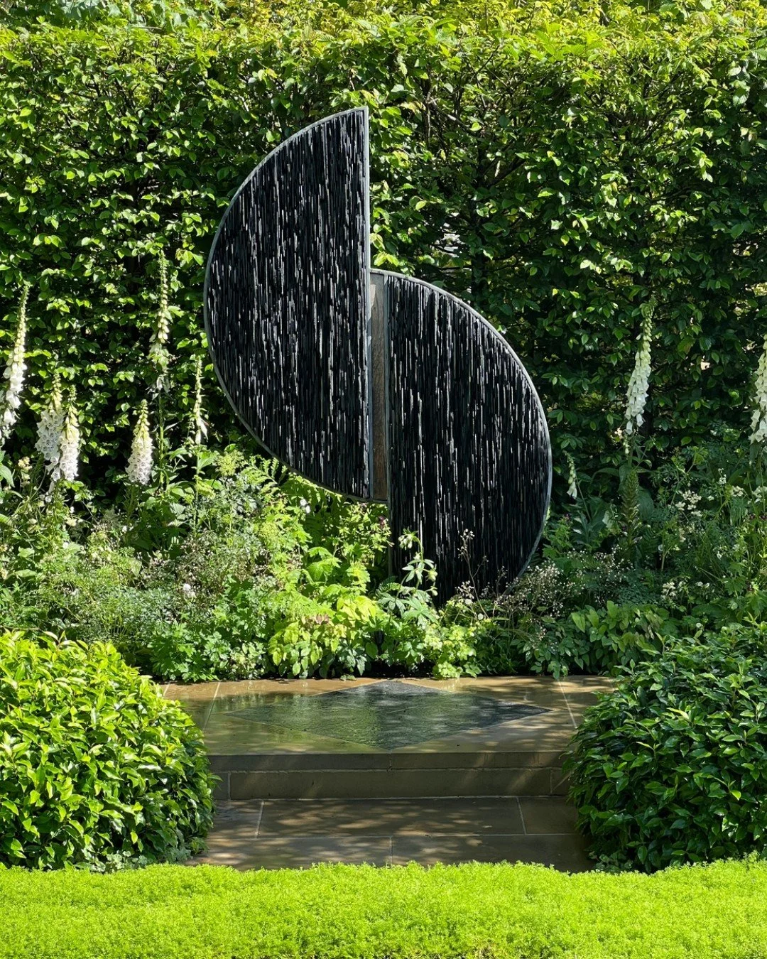 Sculpture in a garden is never just one thing. It can be a play of light, a reflection of the sky, or a focal point that stops you in your tracks. I love how art can transform a space from a simple view into an immersive experience that slows you dow