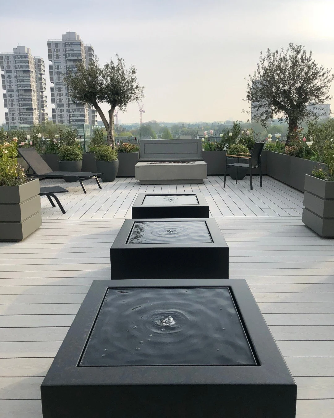 Here in Battersea, water features and carefully placed pots bring structure, movement and softness to an elevated urban space. The sound of water helps quieten the city beyond, while layered planting creates a sense of retreat high above the streets.