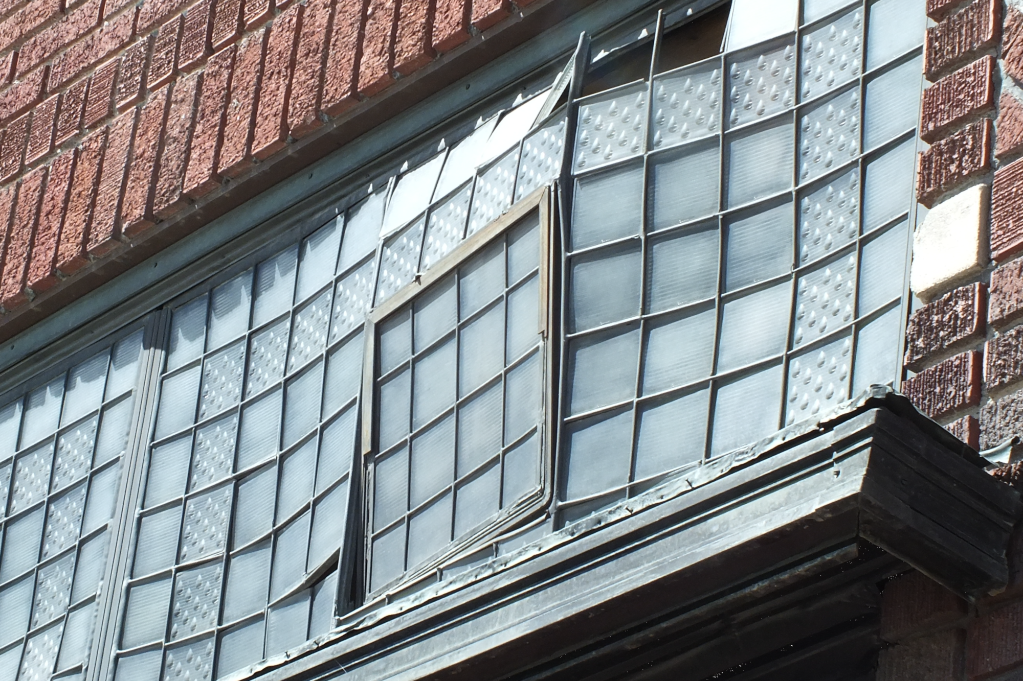 Some of the lead strips that hold the glass in place were failing, causing portions of the window to buckle.