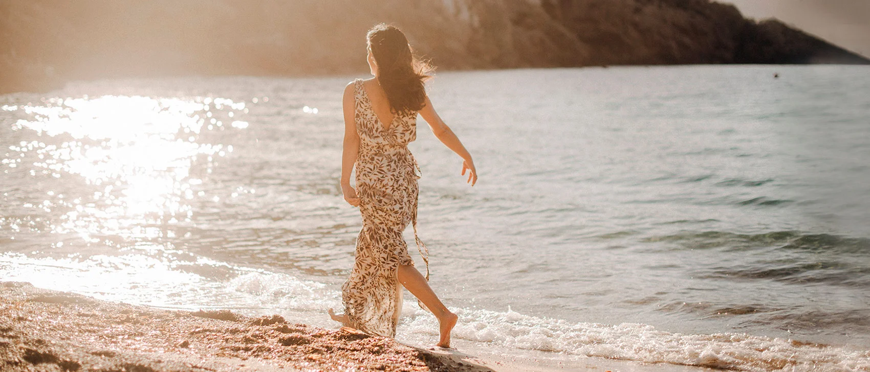 Harmonic_ Escapes_ Ibiza_Founder_Cynthia_running_Benirras_beach_sunset
