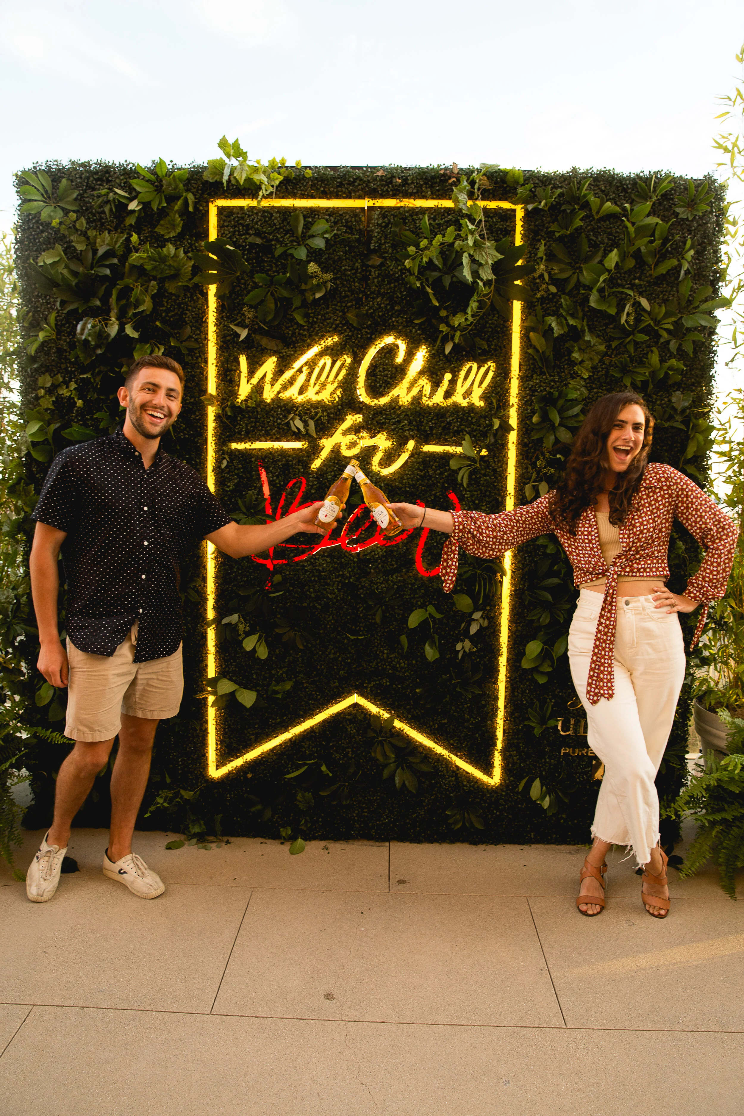  Cheers-ing to a successful Pure Golden Hour, in front of our living wall photo opp. 