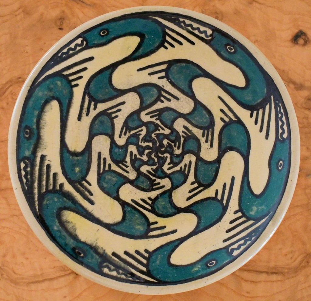  A Rare Shearwater Pottery Plate, c. 1930-40, decorated by Walter Inglis Anderson (1903-1965) with stylized figures of great blue herons in teal blue and black slip, impressed dime size mark, diam. 8 1/2 in. 