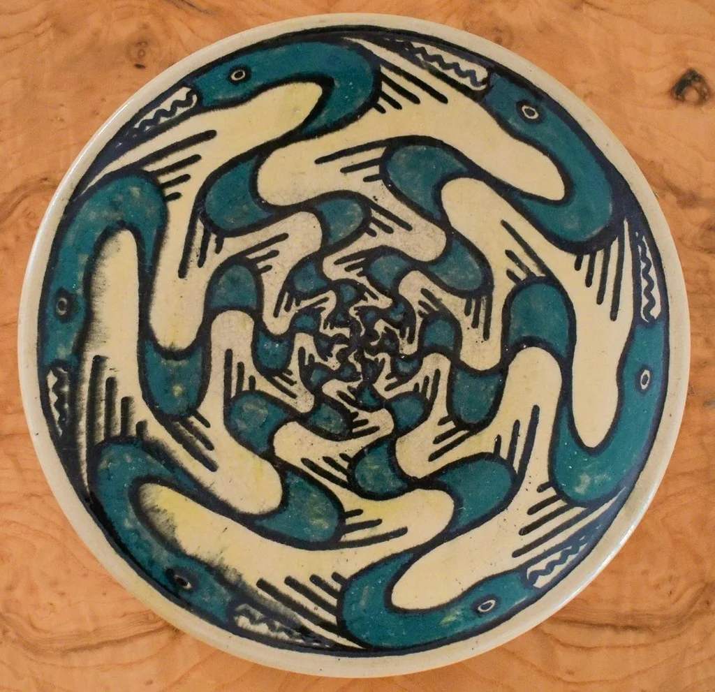 A Rare Shearwater Pottery Plate, c. 1930-40, decorated by Walter Inglis Anderson (1903-1965) with stylized figures of great blue herons in teal blue and black slip, impressed dime size mark, diam. 8 1/2 in.