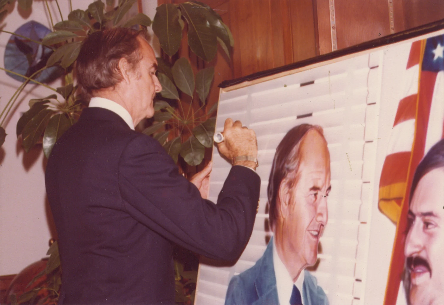 Senator McGovern signing the painting