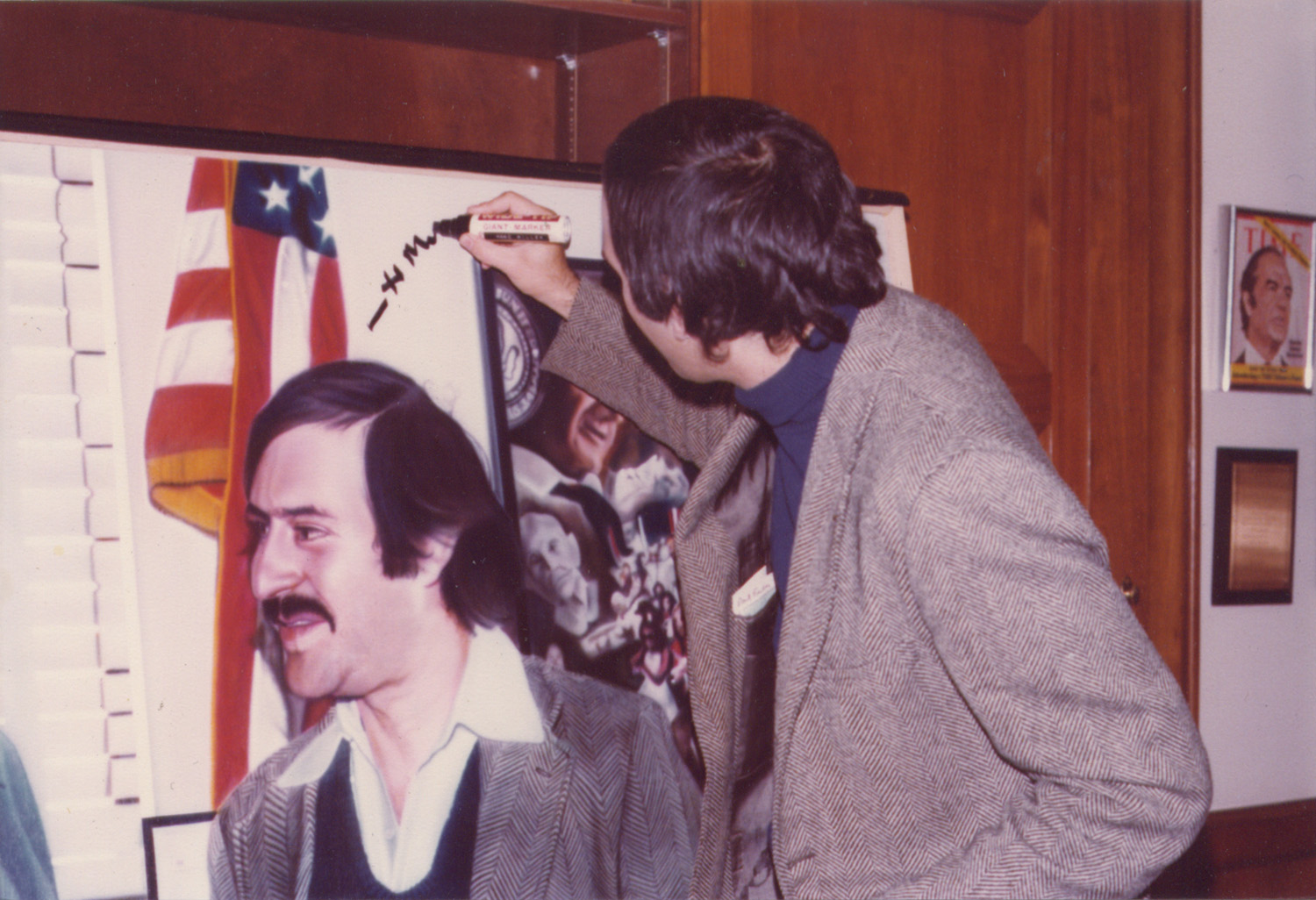 Marc H. Miller signing the painting