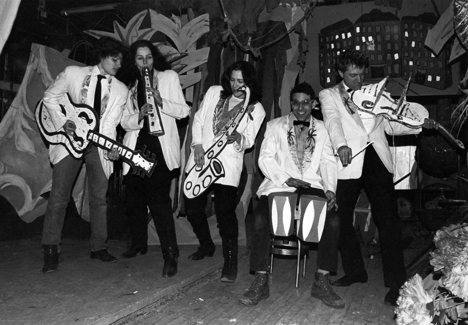 ABC No Rio's Cardboard Band performing at The Isle of Negative Utopia show at The Kitchen, 1983. (left to right) Bebe Smith, Kiki Smith, Ellen Cooper, Bobby G, and Walter Robinson. Photo by Christy Rupp