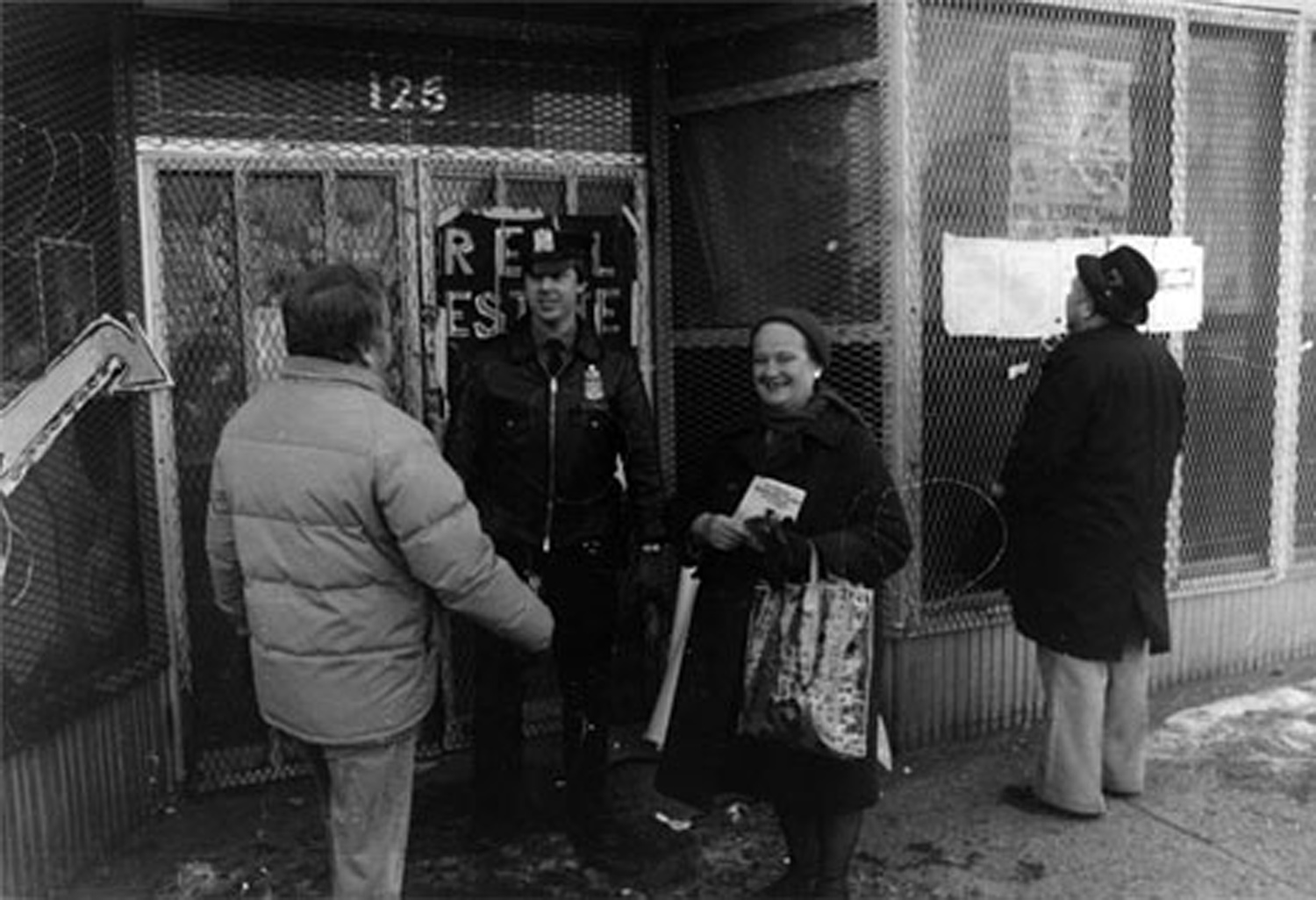 Scene outside the "Real Estate Show" with police guarding the building’s doors following the eviction of the artists, 1980. Photo by Lawrence Lehmann