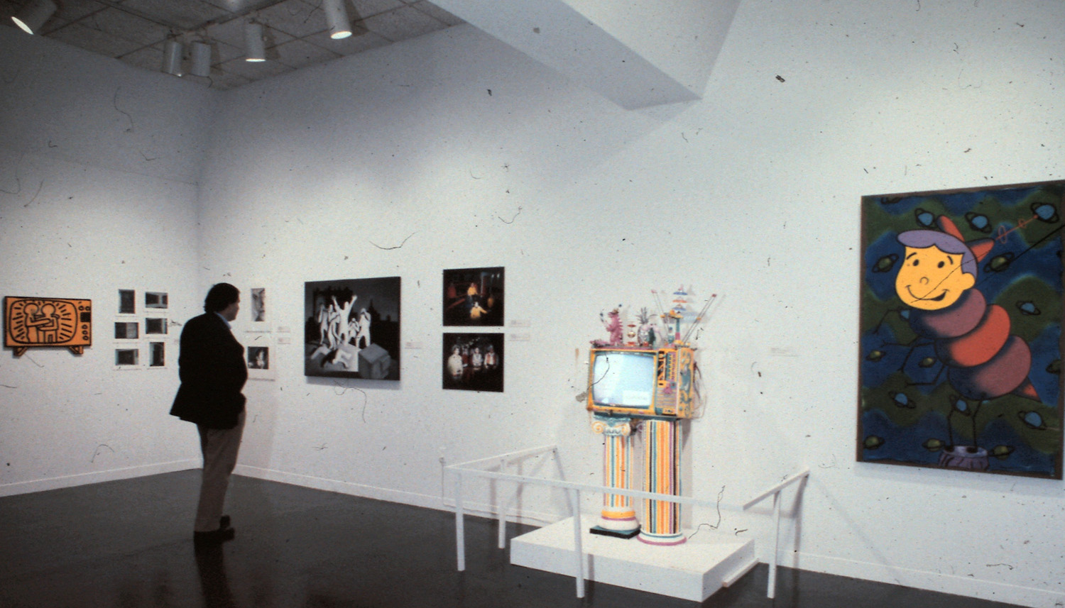 Left to right: Keith Haring, Untitled; Tseng Kwong Chi, Keith Haring Subway Drawings; unidentified (top); Marcia Resnick, She Secretly Lusted for Her Television Idol (bottom); Mark Kostabi, Goya T.V.; Tseng Kwong Chi, Kenny Scharf in "Hanna Barbera" Dance (top); unidentified (bottom); Kenny Scharf, Extravaganza T.V.; Kenny Scharf, Elroy Bug.