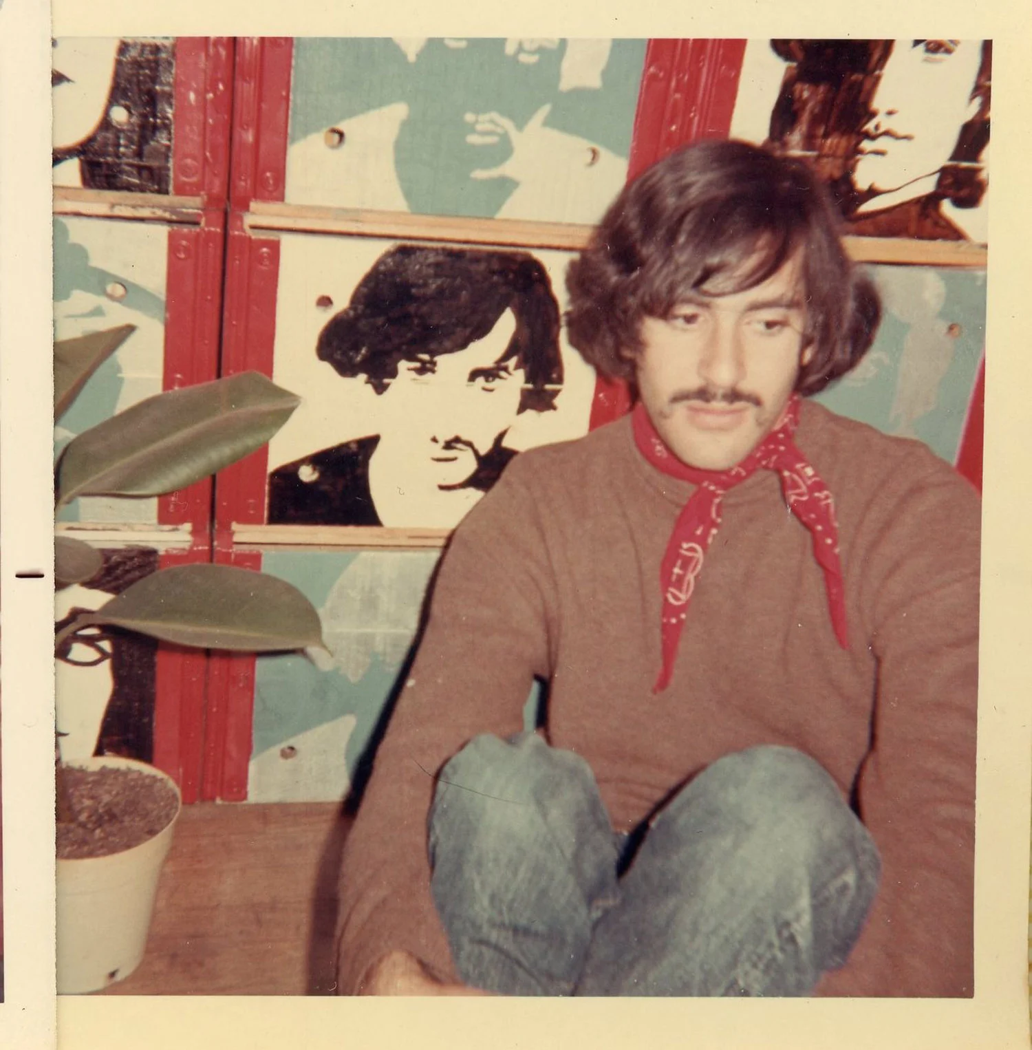 Marc in front of room divider / bookcase made of milk crates, painted by Carla, c. 1969.