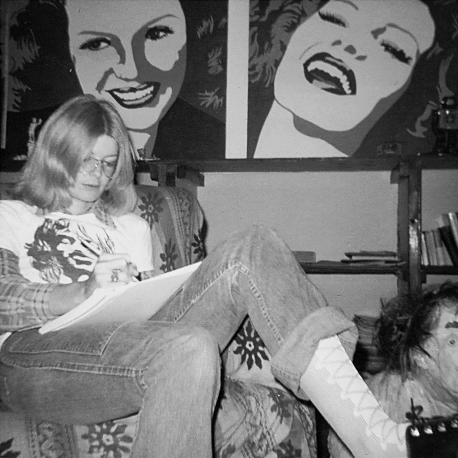 Carla at 98 Bowery (her paintings of Rita Hayworth in the background), c. 1971