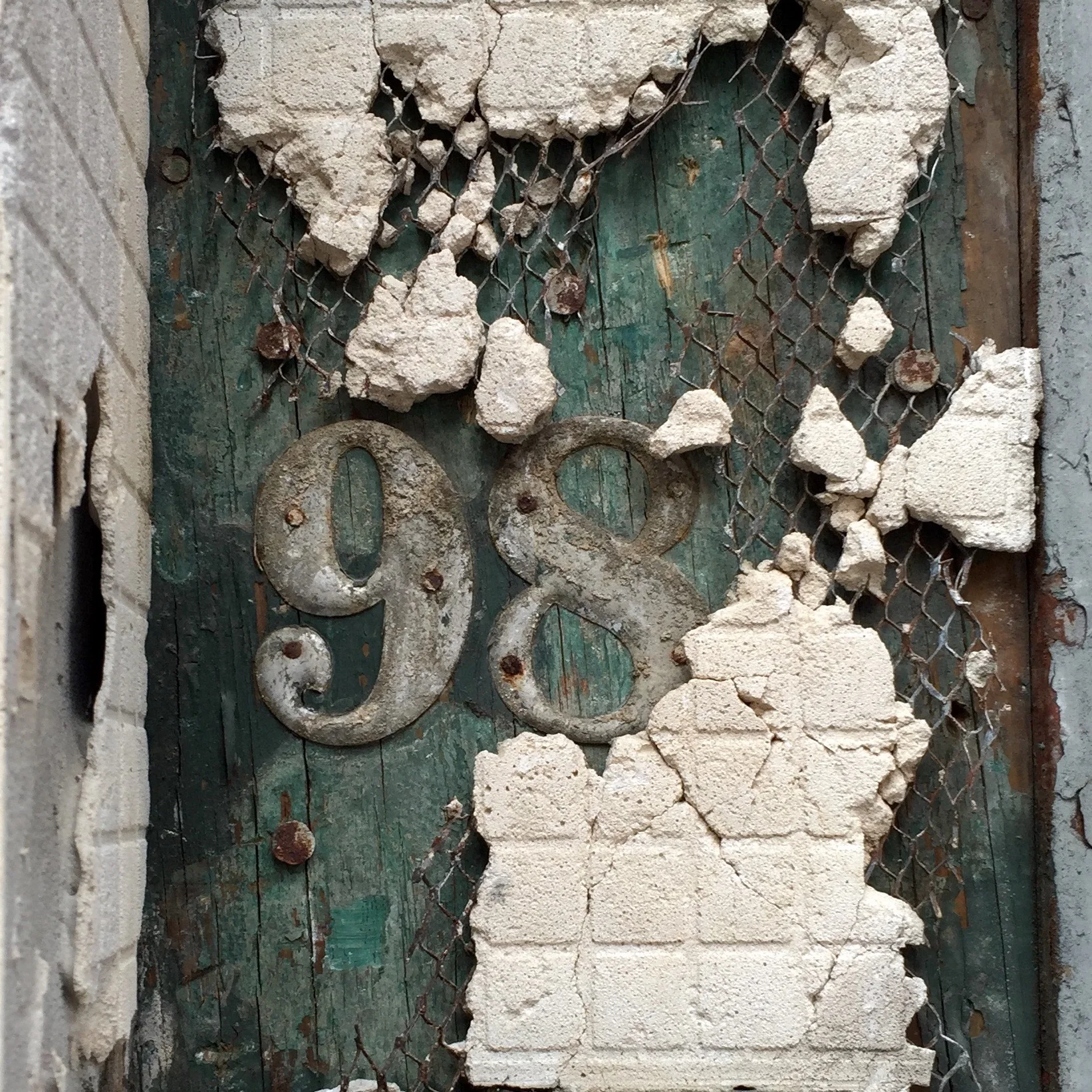 Original building numbers for 98 Bowery revealed in a recent renovation. Photo by Curt Hoppe.