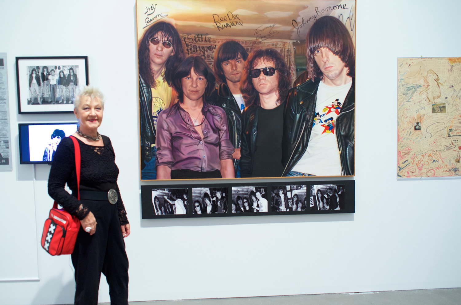 Bettie Ringma with Curt Hoppe's painting "Bettie and the Ramones." Photo by Curt Hoppe.