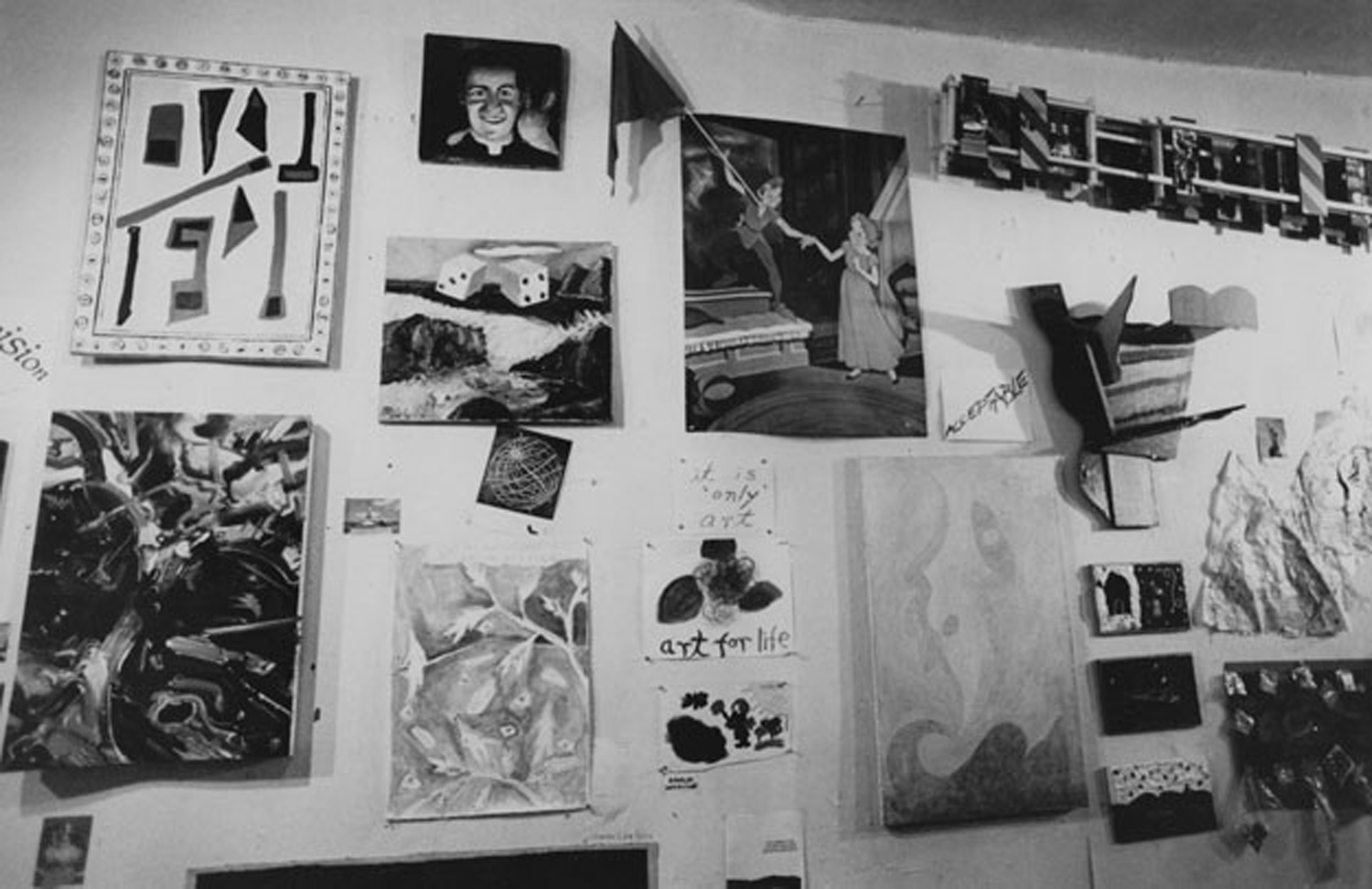 Installation view shows works by Harry Spitz (bottom, third from right), Jody Culkin (sculpture above right), and center, Tom Rollin's altered readymade. Photo by Lisa Kahane